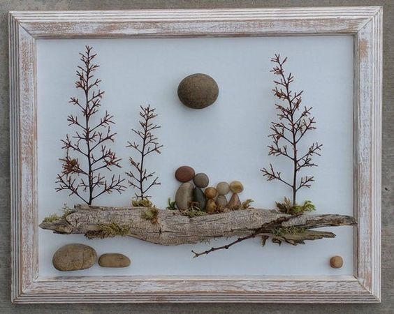 framed art made of pebbles, sticks, and other bits of nature