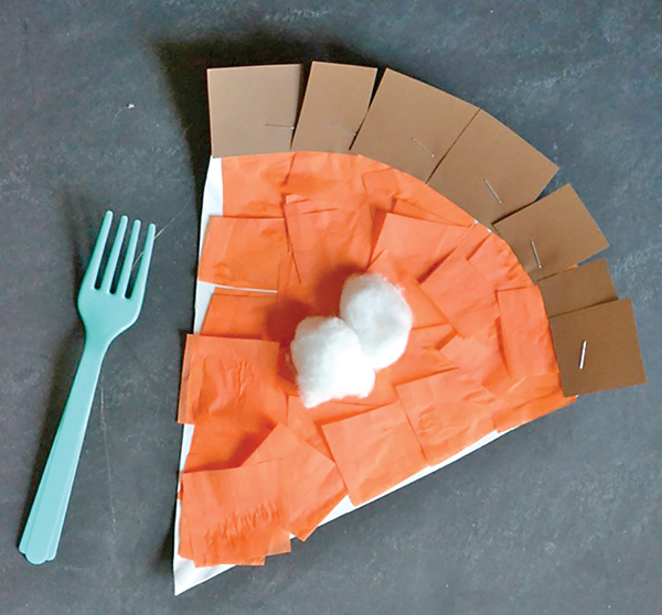 slice of pumpkin pie made with construction paper, tissue paper, and cotton balls