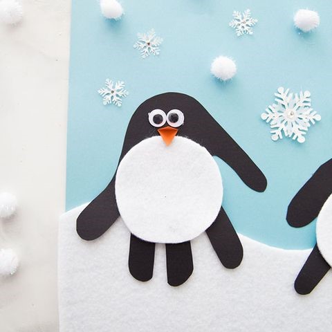 penguin craft using handprint cutouts