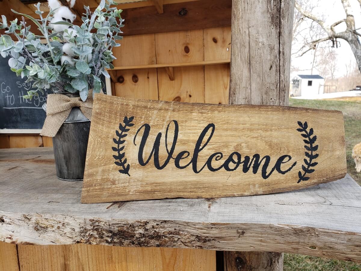 painted wooden welcome sign