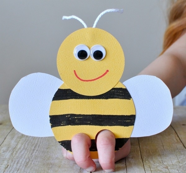 a smiling bee finger puppet