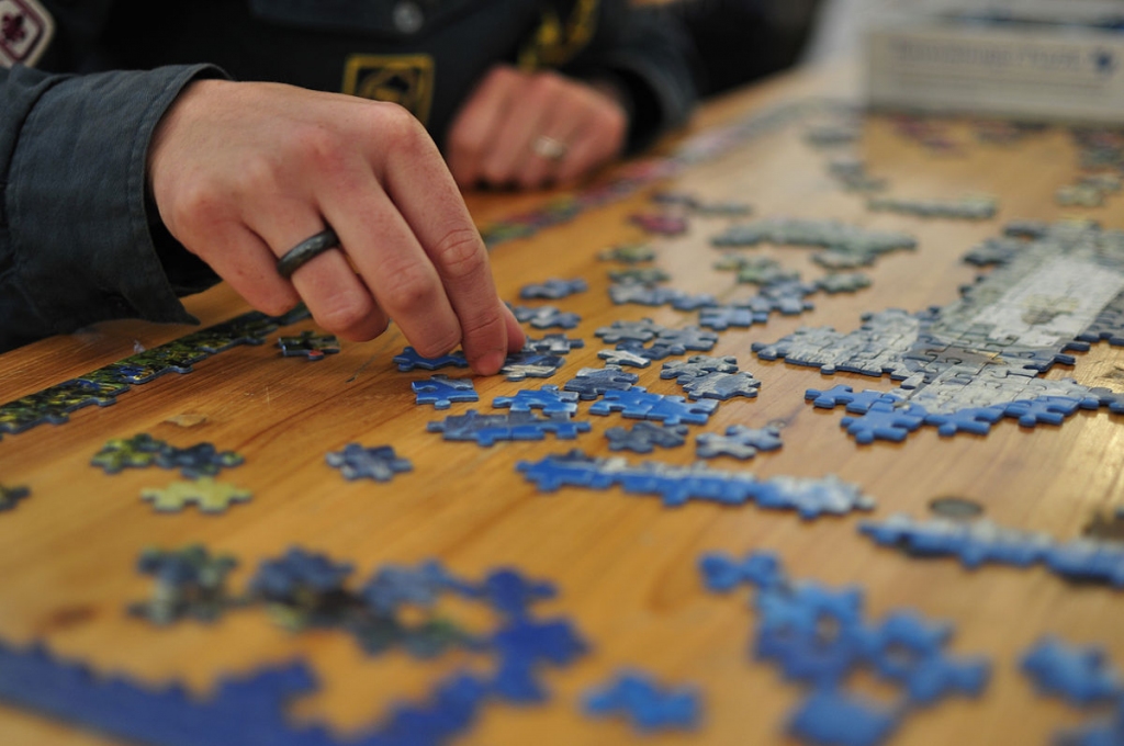 person working on a puzzle