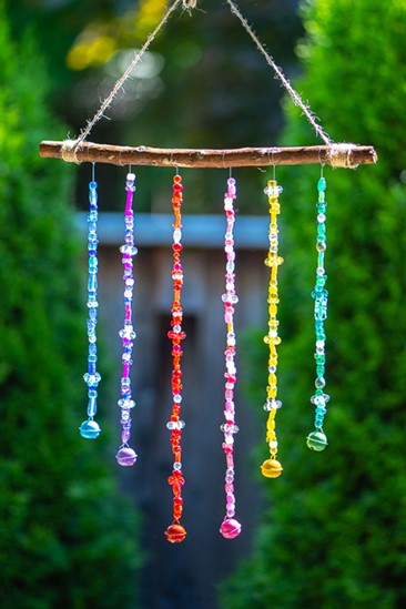 wind chime craft made from beads and a stick