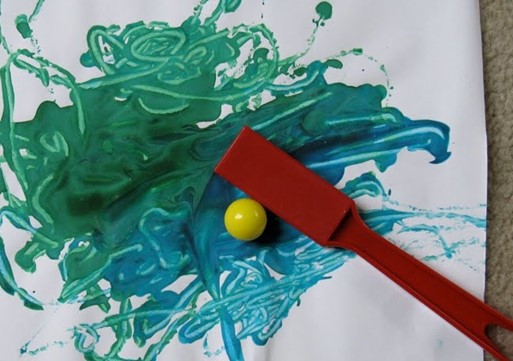 painting with a ball and a magnet