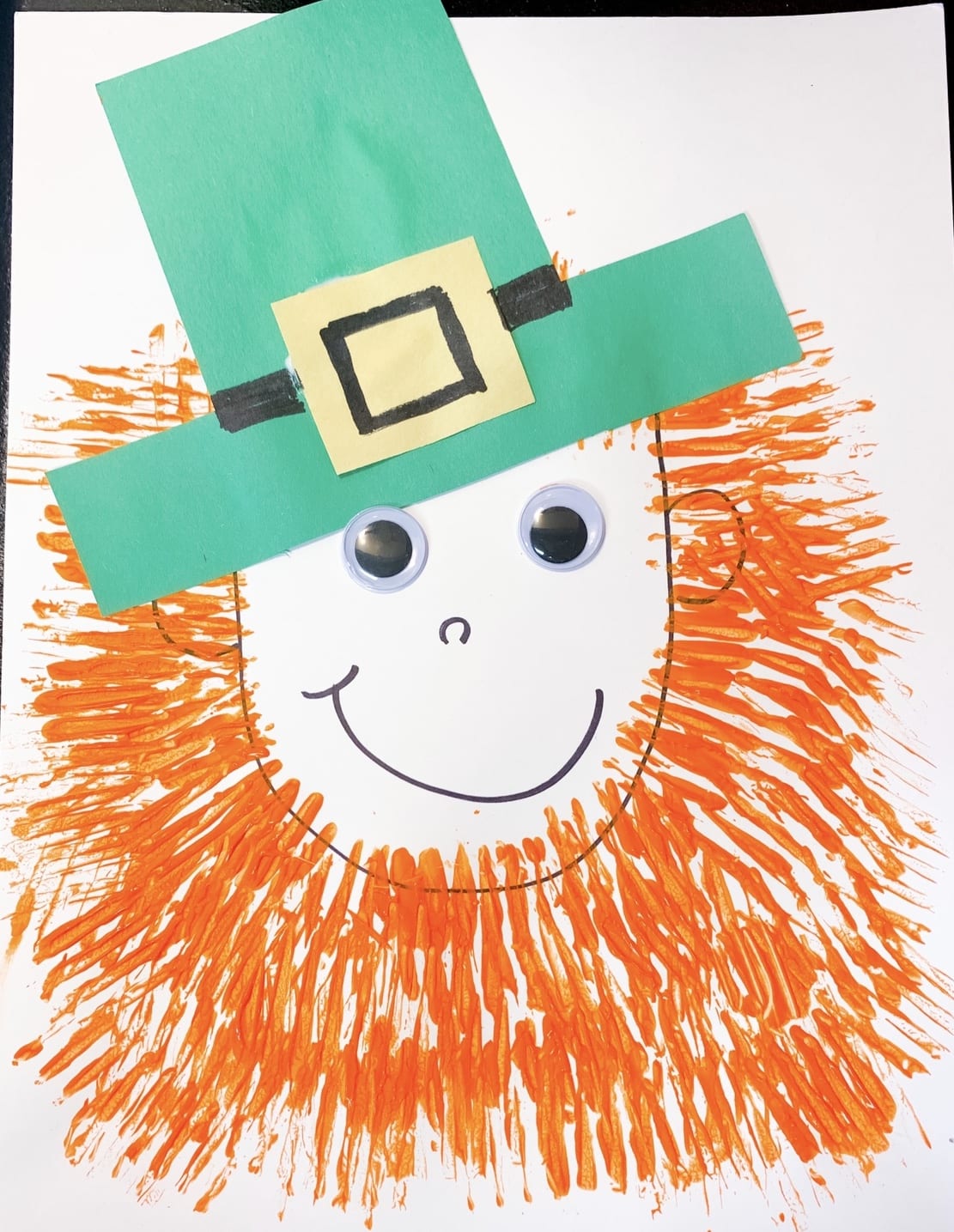 leprechaun craft made with a fork and construction paper