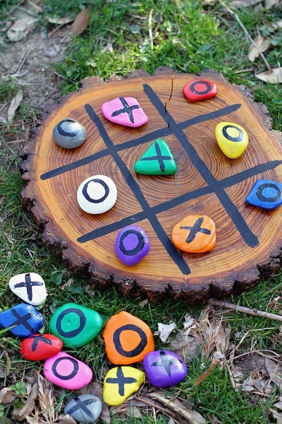 tic tac toe game made with painted rocks