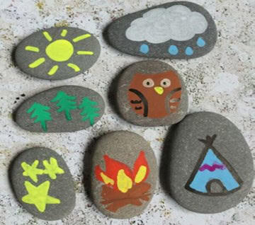 several rocks painted with various outdoor themed designs