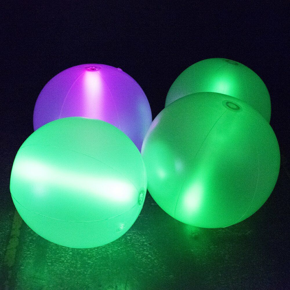 4 glowing beach balls