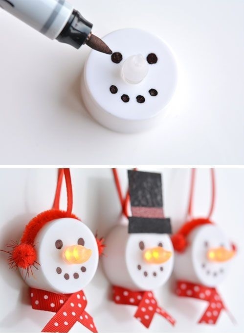 Snowman made by drawing a face onto a tealight and adding a felt hat and bow tie