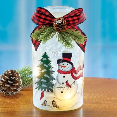 Mason jar decorated with snowman and tree