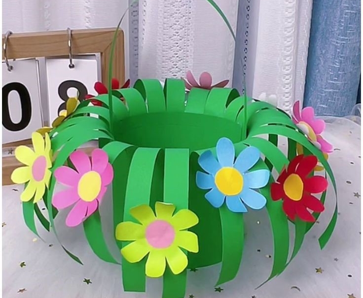 Green paper Easter basket with paper flowers