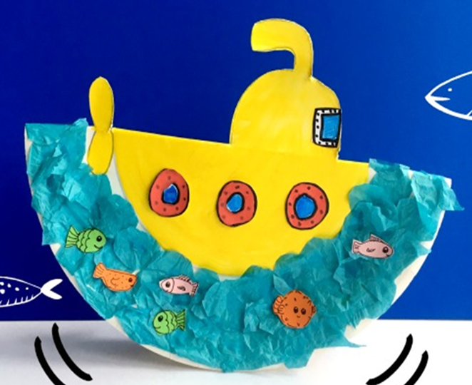 painted paper plate folded in half with submarine parts and paper circles for windows