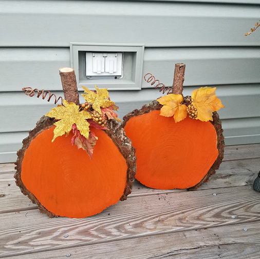 Pumpkins made using a painted orange wood slice