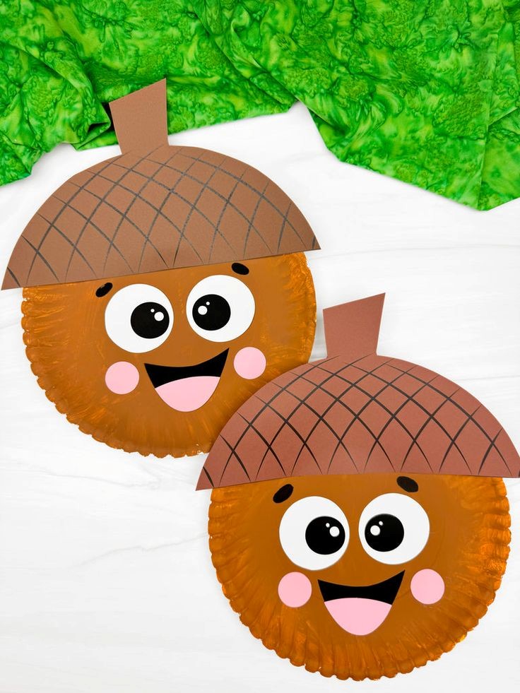 smiling acorn craft made using a paper plate and other paper