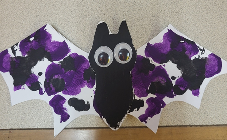 construction paper bat, painted with googly eyes