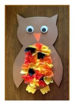 paper owl with tissue paper feathers on its stomach