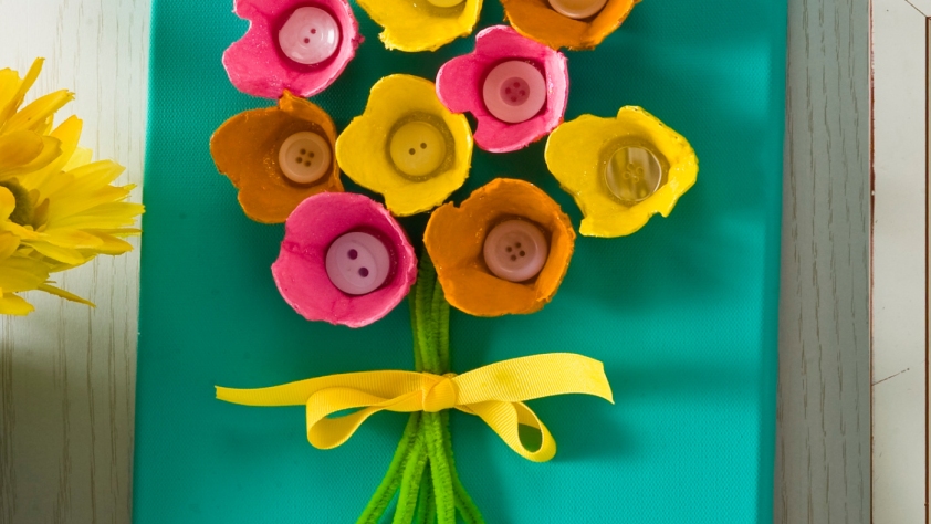 bouquet of flowers picture made using egg cartons for the flowers, a bow, and pipe cleaners for stems