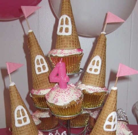 castle made using cupcakes, frosting, and an upside down ice cream cone