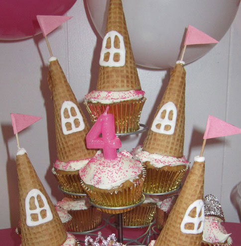 castle made using cupcakes, frosting, and an upside down ice cream cone