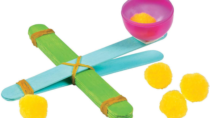 game made using pom poms and craft sticks