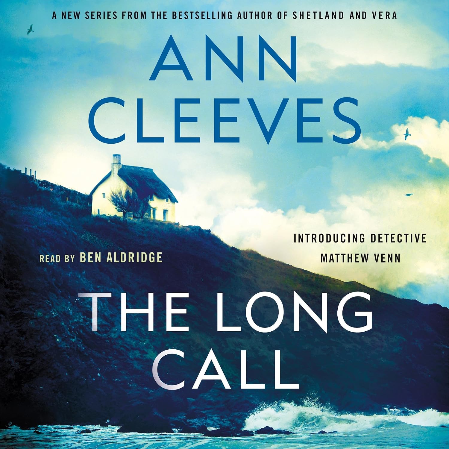 The Long Call written by Ann Cleeves book cover with single house near a cliff by water