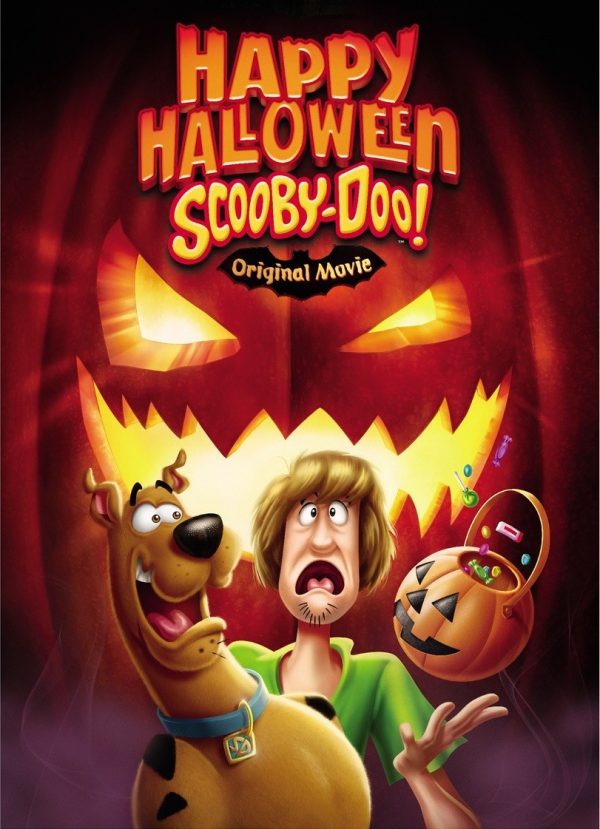 animated scooby doo characters (scooby the dog and his human friend shaggy) looking scared in front of a large scary looking jack-o-lantern
