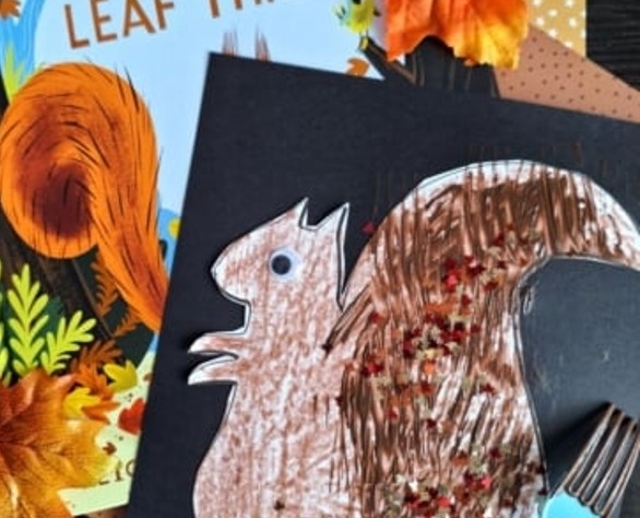 picture of a children's book with the title The Leaf Thief and an image of a squirrel picture cut out, glued on construction paper with the tail painted brown with a fork instead of a paint brush