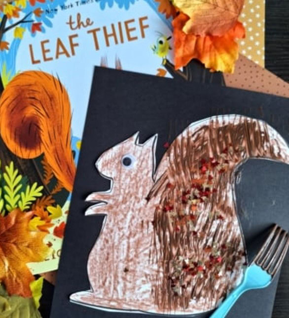 picture of a children's book with the title The Leaf Thief and an image of a squirrel picture cut out, glued on construction paper with the tail painted brown with a fork instead of a paint brush
