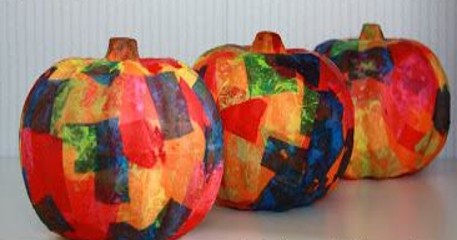 picture of small pumpkins decorated with colorful tissue paper