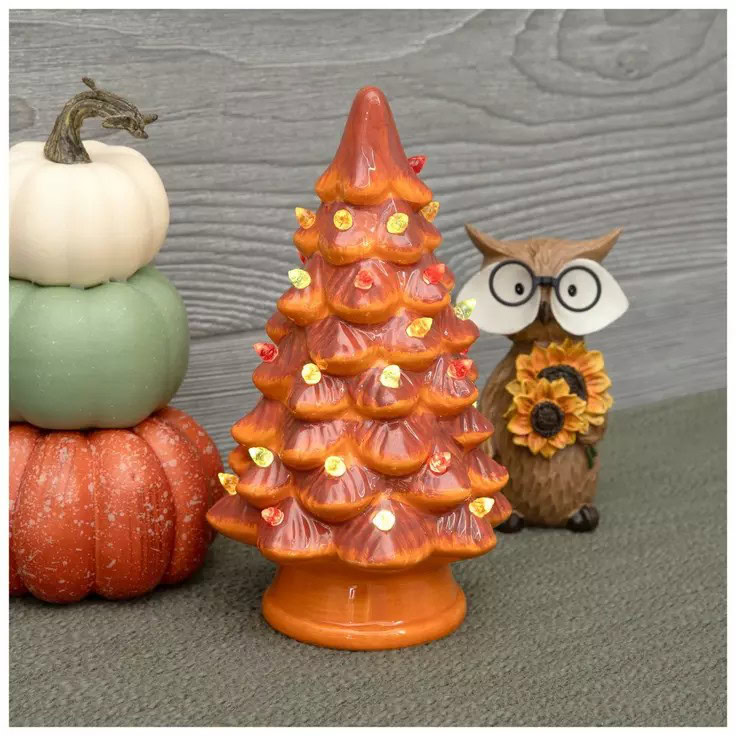 white, green and orange pumpkin stack, ceramic owl, and orange light up ceramic tree